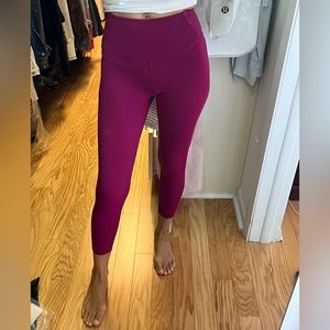NWOT Size 2. Lululemon magenta leggings with lazer cut hems.